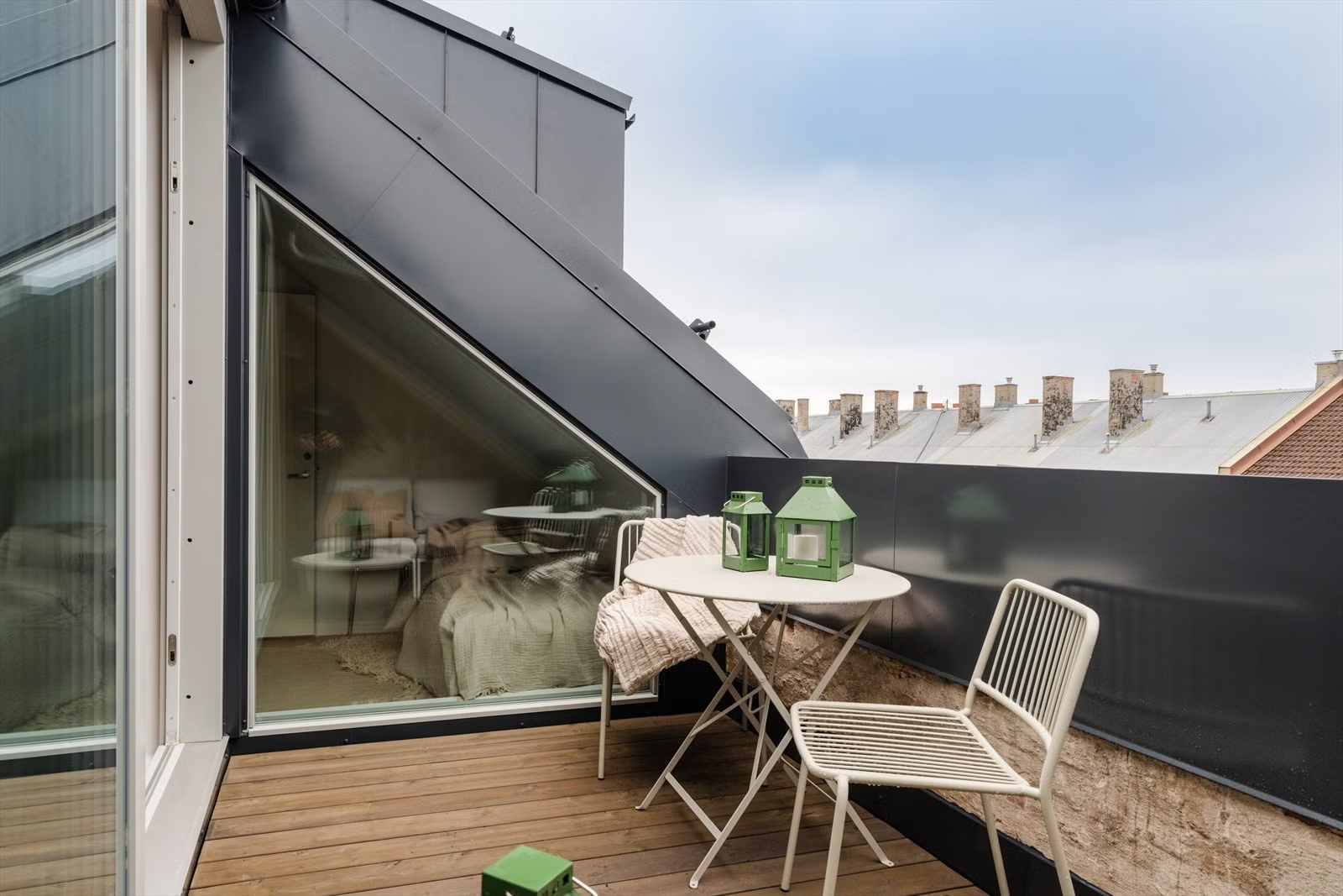 Rooftop terrace connected to the Living Under the Sky attic apartment in Oslo by IK-architects