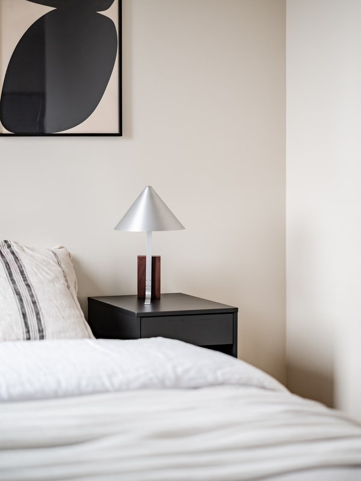 Minimal bedroom detail in the Living Under the Sky attic apartment in Oslo by IK-architects